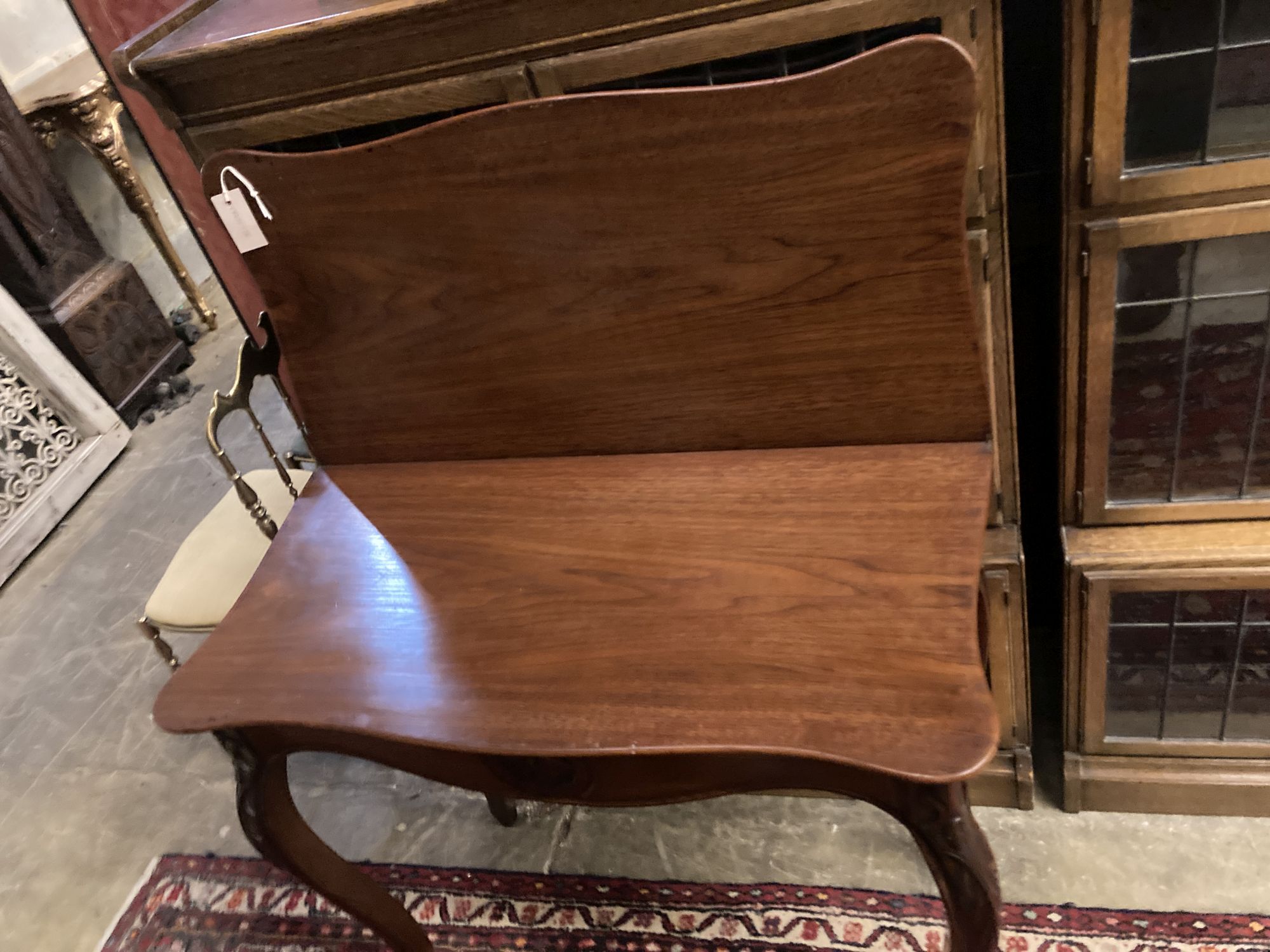 A 19th century French walnut serpentine folding tea table, width 85cm, depth 42cm, height 76cm